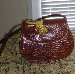 Gold buckle alligator purse